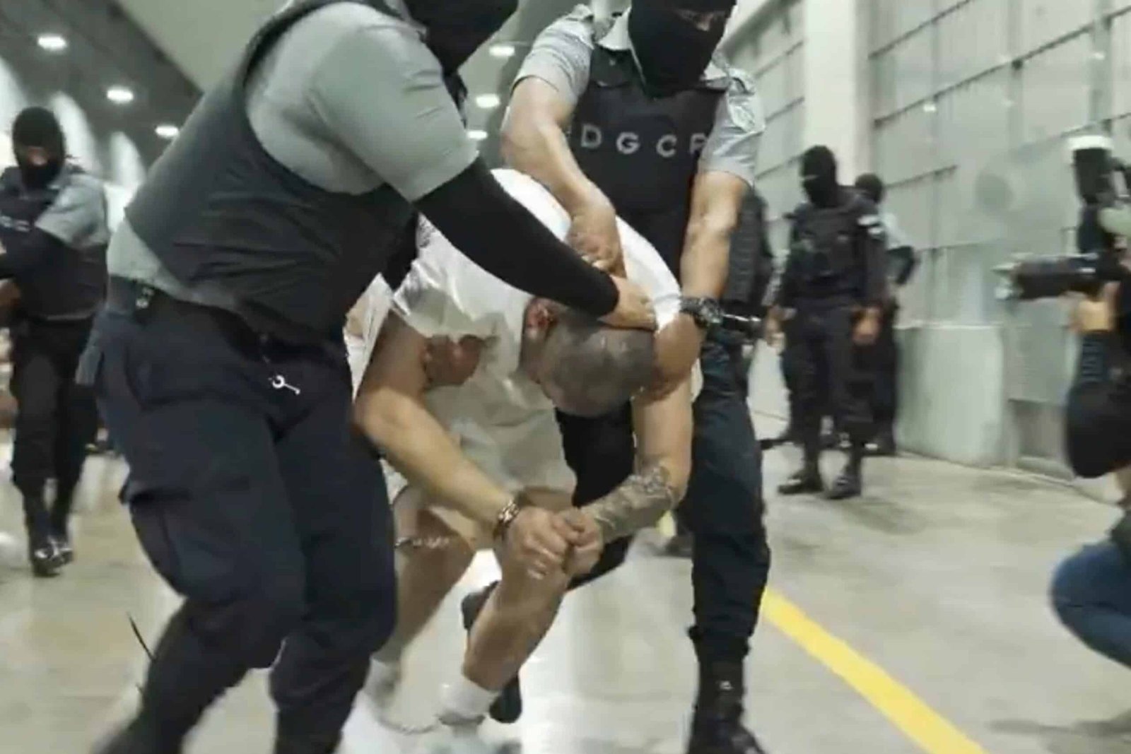 Photo: Photo of a man who is not dated identified by Jennifer Vasquez Sura as her husband, Kilmar Abrego Garcia, forcibly led by guard through the center of terrorism in Tecoluca, El Salvador.