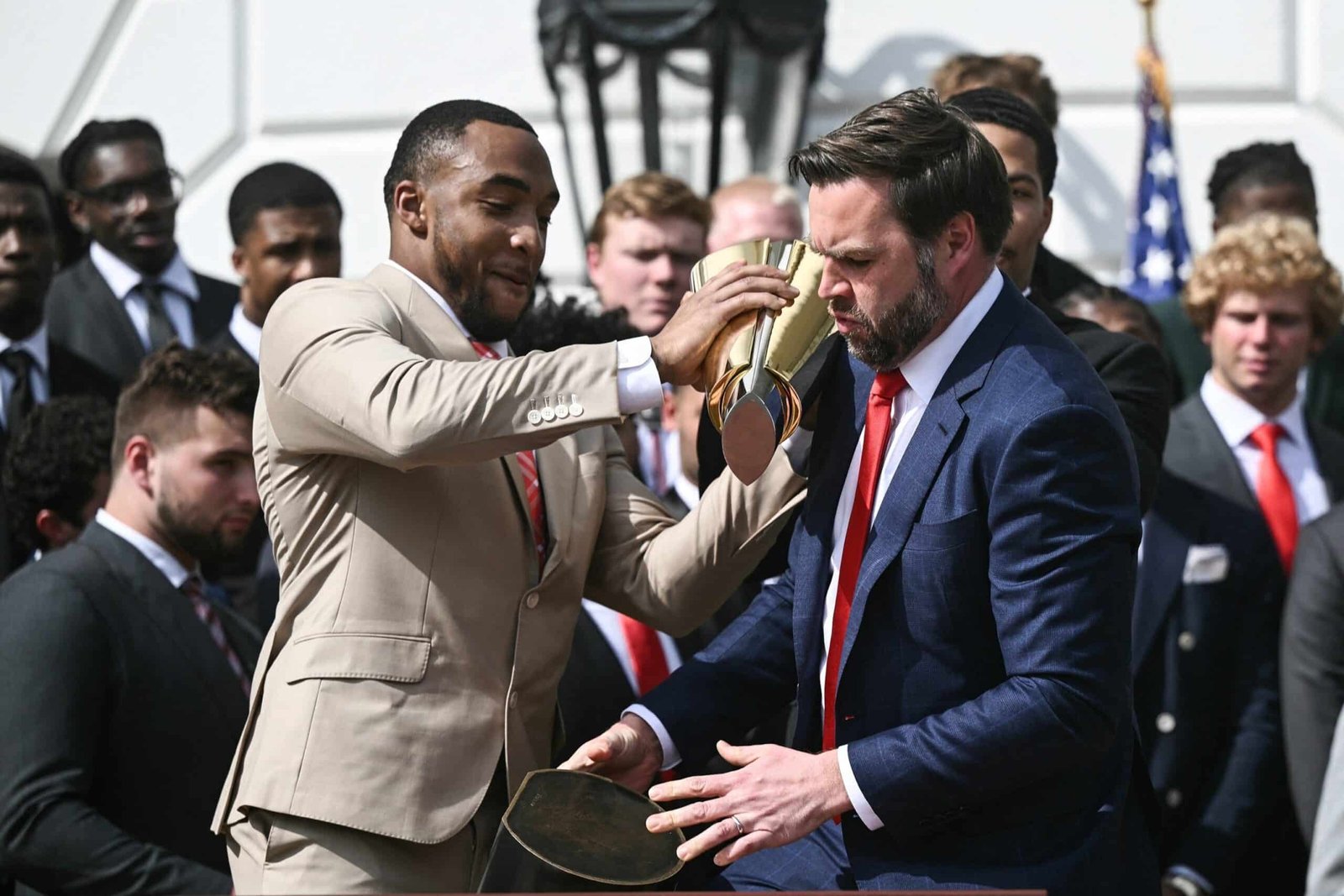 Photo: Vice President JD Vance holds a separate trophy when President Donald Trump welcomes the national champion of the 2025 college soccer, the Ohio State University soccer team to the White House, April 14, 2025, in Washington.