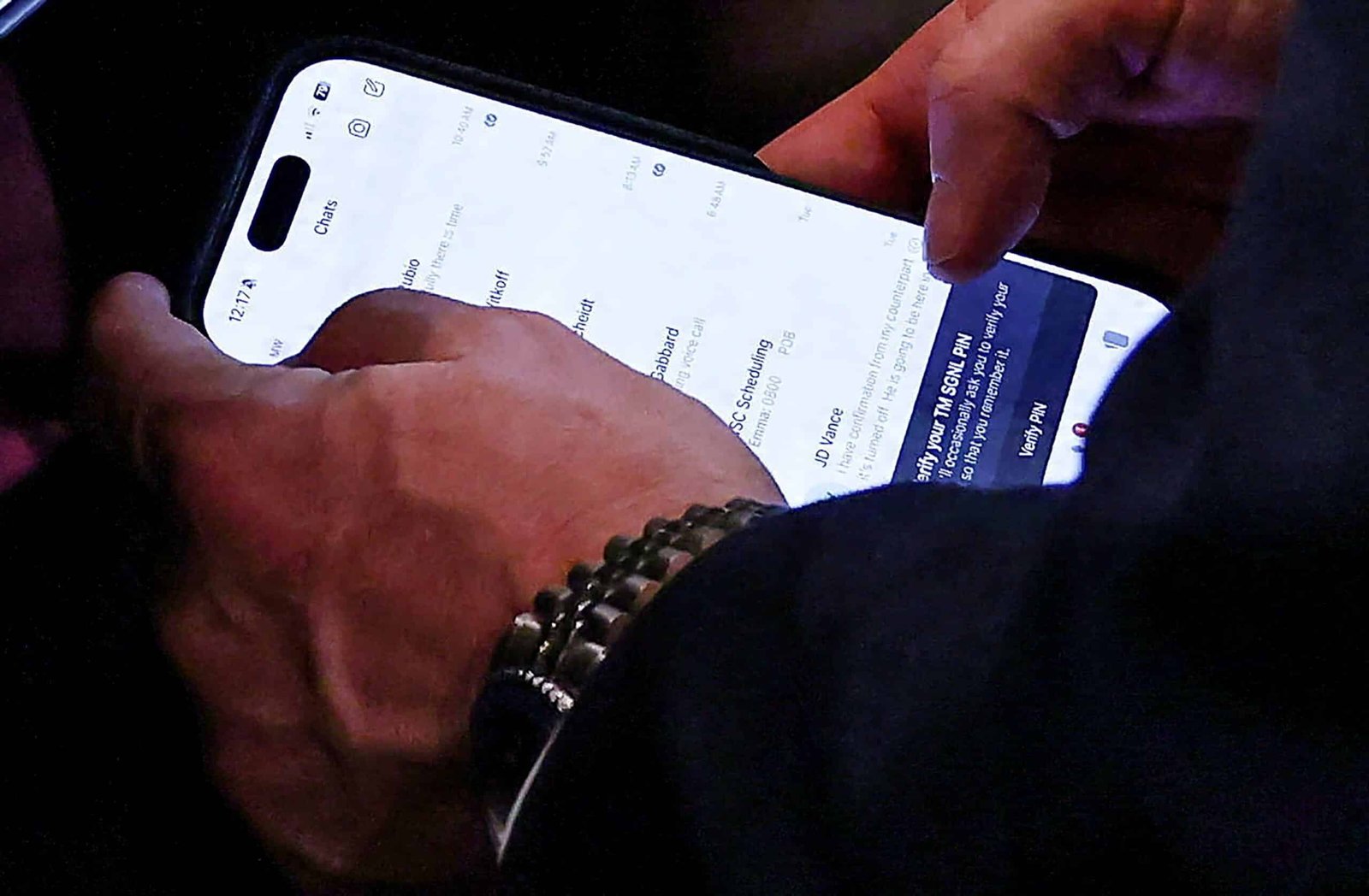 Waltz is photographed using a signal during the Trump cabinet meeting the day before its removal


