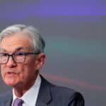Fed holds a stable interest rate, opposing Trump