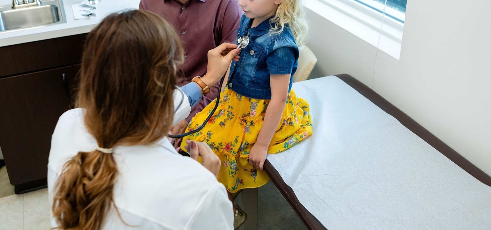 Photo: A doctor examines a child in the office in a stock of photos that is not dated.